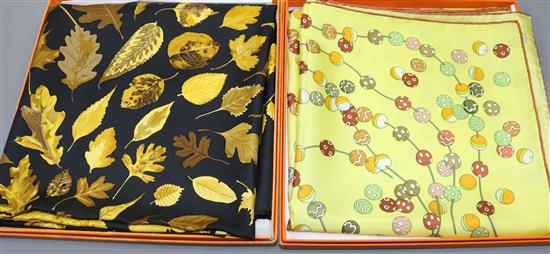 Two Hermes scarves, Dancing Pearls and another with Autumn leaves on a black background, original boxes